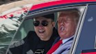 US President Donald Trump and Elon Musk try out a Tesla in happier times at the White House in March.