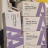 A stockpile of COVID-19 rapid antigen tests on display at Southon’s Chemist in Sydney.