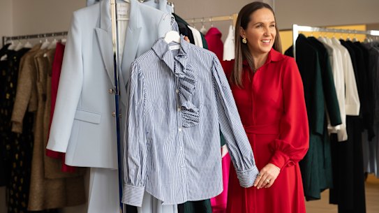 Personal stylist Caitlin Stewart looks at clothes at Australian fashion designer Sarah Lloyd’s showroom in Redfern, Sydney.