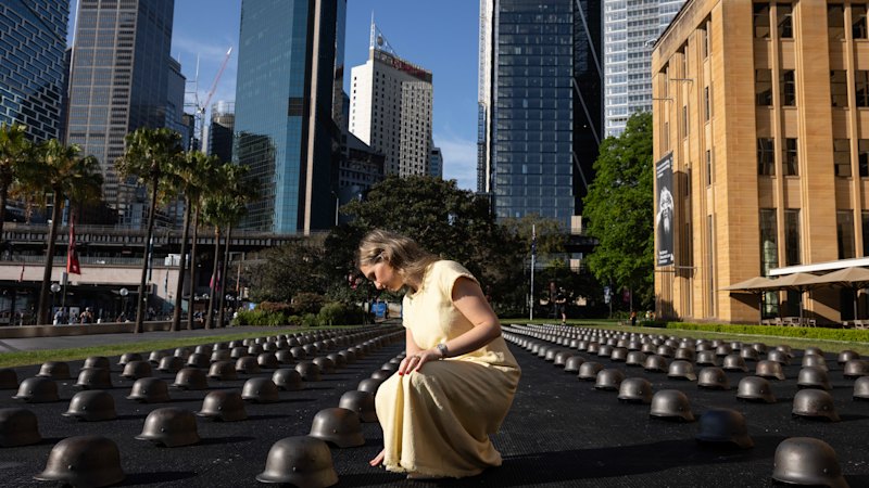 500 combat helmets on Sydney Harbour: This global artist-activist’s call for peace
