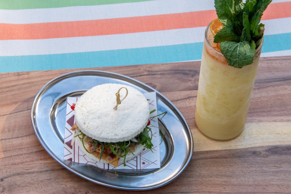Inuman’s chicken skin sandwich and Tito Ray cocktail both channel tropical resort.