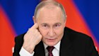 Russian President Vladimir Putin speaks to journalists in the Grand Palace at the Kremlin.