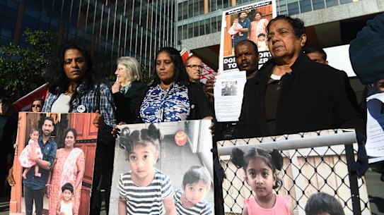 Supporter's of the Biloela Tamil asylum seeker family gather outside of the Federal Court in Melbourne on Wednesday.