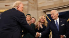 Donald Trump shakes hands with Joe Biden at Monday’s inauguration. The contents of Mr Biden’s letter to his successor will be released in a few years.