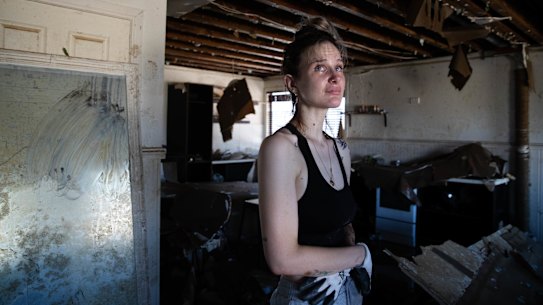 Emily Chave is overwhelmed by the destruction of her home in Woodburn - which she renovated herself - as she enters it for the first time.