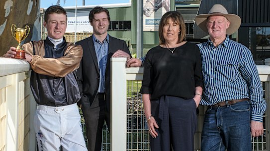 Jockey Harry Coffey with brother Sam, mum Maree and dad Austy.