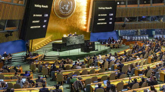 Voting results are displayed as the UN General Assembly voted on a nonbinding resolution calling for a “humanitarian truce” in Gaza.