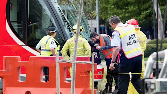 Emergency services at the scene of a collision between a tram and a pedestrian in Canberra on Saturday morning.