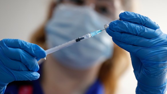 A nurse prepares a shot of the Pfizer-BioNTech COVID-19 vaccine at Guy's Hospital in London.