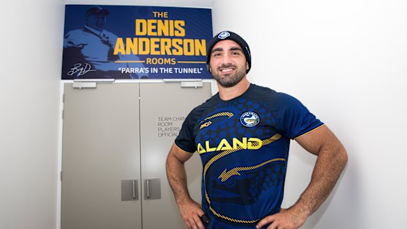 Proud: Tim Mannah outside the dressing-rooms at Bankwest Stadium.