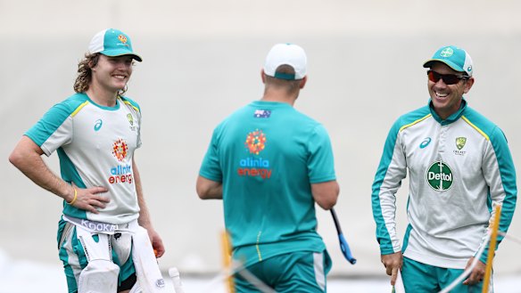 Pucovski and coach Justin Langer (right) train at the SCG on Wednesday.