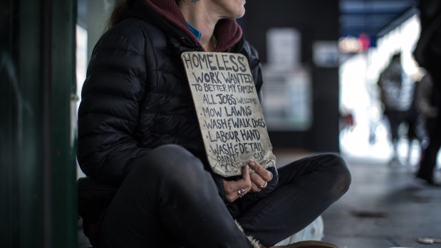 'I'm busting to get back to work': homeless woman Rachel, 37, appeals for work in Elizabeth Street, Melbourne. 