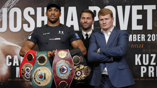 Showdown: Britain's Anthony Joshua (left) and Russia's Alexander Povetkin (right) pose ahead of their fight at Wembley.
