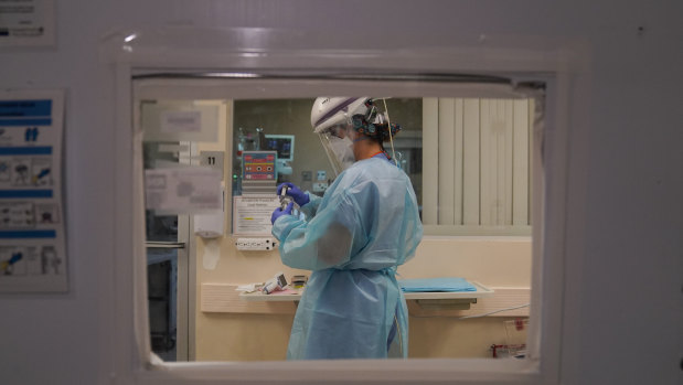 A nurse works in a COVID-19 unit at Mission Hospital in California. 