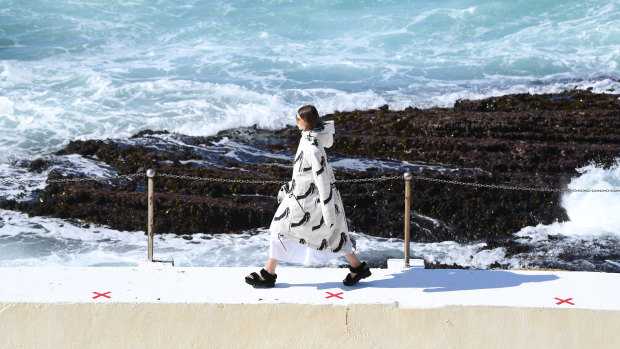 A model walks the runway wearing creations by Ten Pieces during Mercedes-Benz Fashion Week Australia.