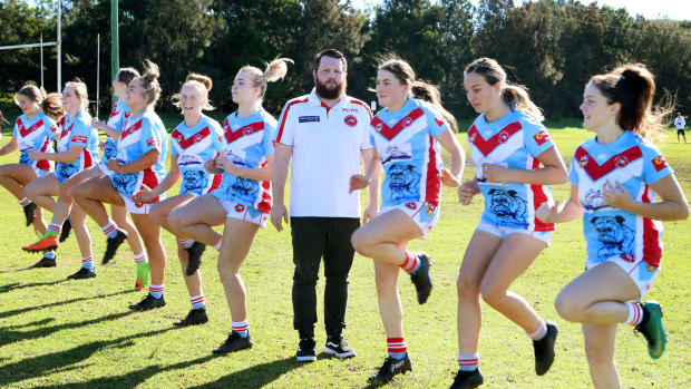 Coach Sam Anderson puts the Ulladulla Bulldogs under 18's through their warm-up on Saturday.