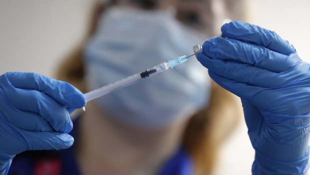 A nurse prepares a shot of the Pfizer-BioNTech COVID-19 vaccine at Guy's Hospital in London.