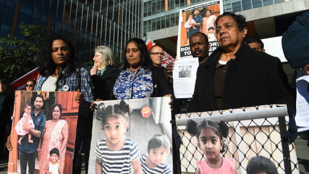 Supporters of the Biloela Tamil family gather outside of the Federal Court in Melbourne on Wednesday.