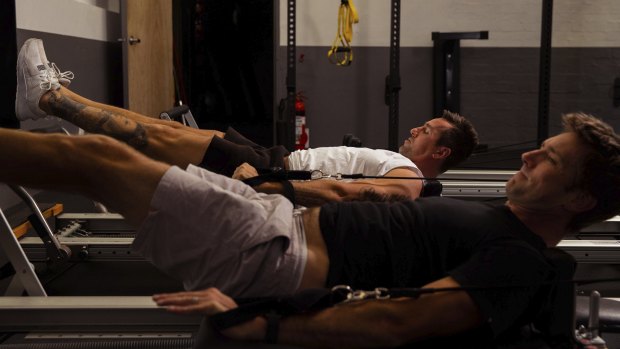 Mitchell Pearce with personal trainer Matthew Garry.