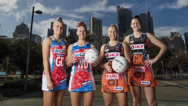 Derby: Maddy Turner, Abbey McCulloch, Kim Green and Sam Poolman model the Indigenous dresses the Swifts and Giants will wear this weekend.