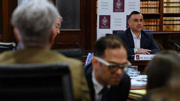 John Barilaro (right) giving evidence during the inquiry and Labor’s Daniel Mookhey (centre).