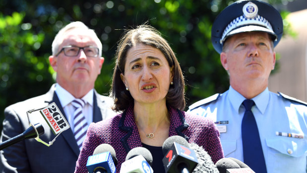 Premier Gladys Berejiklian, with Health Minister Brad Hazzard and NSW Police Commissioner Mick Fuller, announces the inquiry on Monday. 