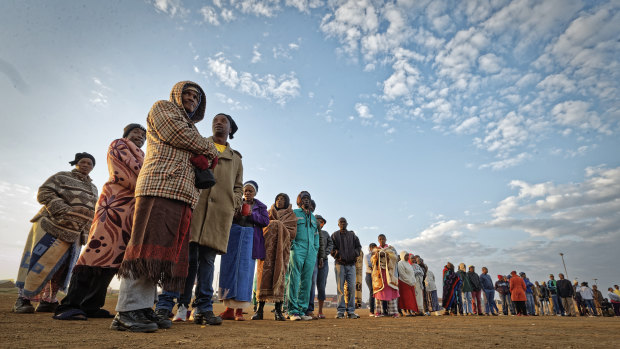 South Africans queue in the early morning cold to cast their votes in the mining settlement of Bekkersdal, west of Johannesburg, on Wednesday.