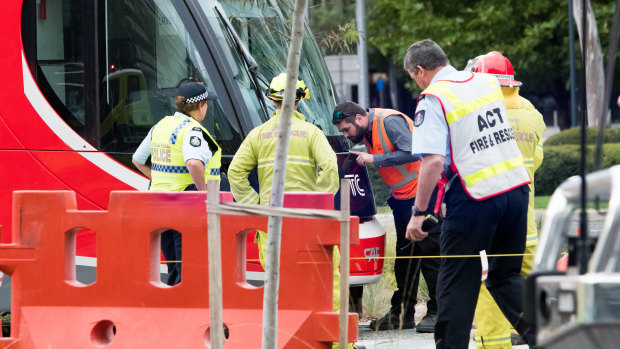 Emergency services at the scene of a collision between a tram and a pedestrian in Canberra on Saturday morning.