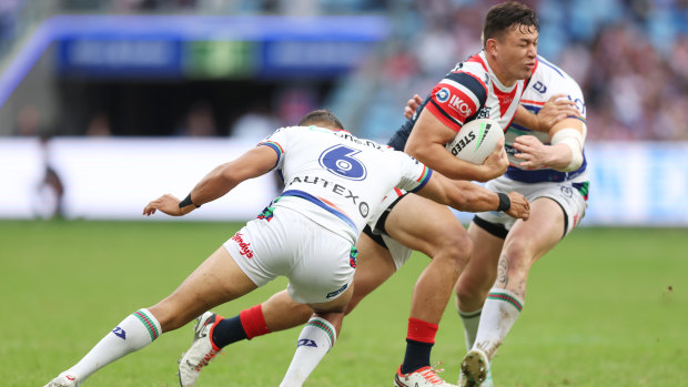 Joseph Manu takes a carry against the Warriors.