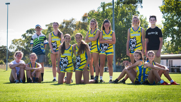 The under 15 girls Oztag team (with two of their brothers)  (front) Chloe and Nellie O’Donnell, Maddie and Ellie Hyland, Samantha and Kaylee Charlton, and (back) Cambell and Georgia Willey, Abbie and Samantha Bailey (all 14) with Sara and William Hannaford (15). 