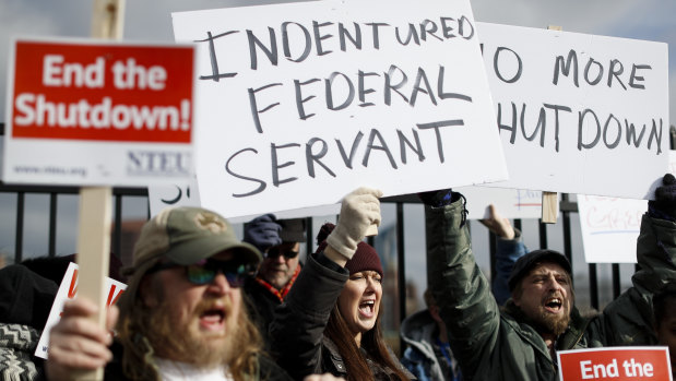 Union members and Internal Revenue Service workers rally outside an IRS Service Centre in Covington, Kentucky.