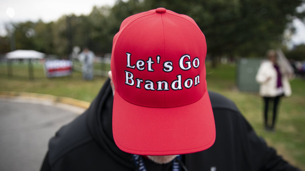A supporter of former US president Donald Trump wears a “Let’s Go Brandon” hat in Arlington, Virginia.