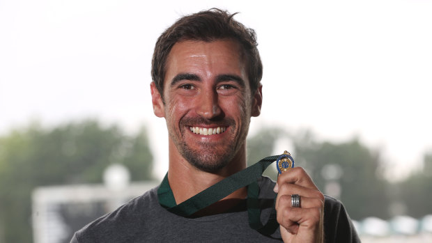 Mitchell Starc with his new Allan Border Medal at Manuka Oval on Saturday. 