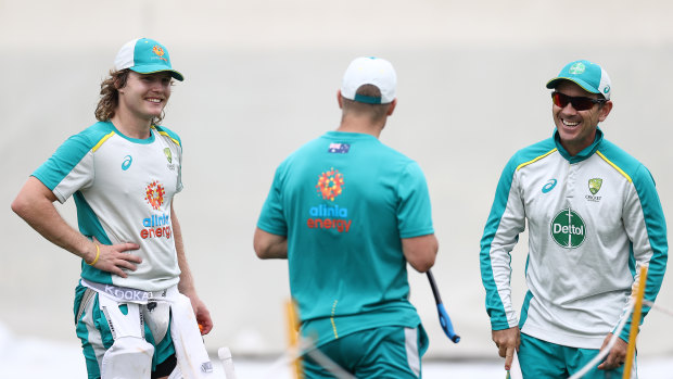 Pucovski and coach Justin Langer (right) train at the SCG on Wednesday.