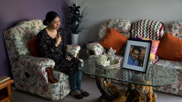 Sharmil Maharaj with a portrait of her late husband, Praween Maharaj, in their Gregory Hills home.