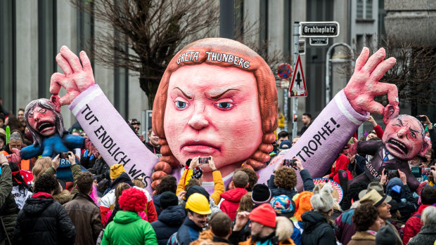 Greta Thunberg has become a living icon of the issue of climate change: A float with her effigy makes its way past revellers during the Rose Monday carnival parade in Dusseldorf, Germany. 