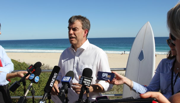 Fisheries Minster Dave Kelly wants the NSW government to release the final report of research into shark deterrent devices.