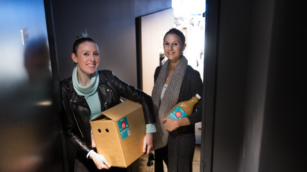 Lauren Davie  and Elena Andoniou delivering their hot apple cider to cafe Monroe in Richmond.