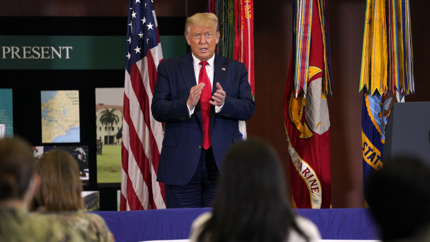 President Donald Trump claps after delivering a speech about the US anti-narcotics operations in Doral, Florida.