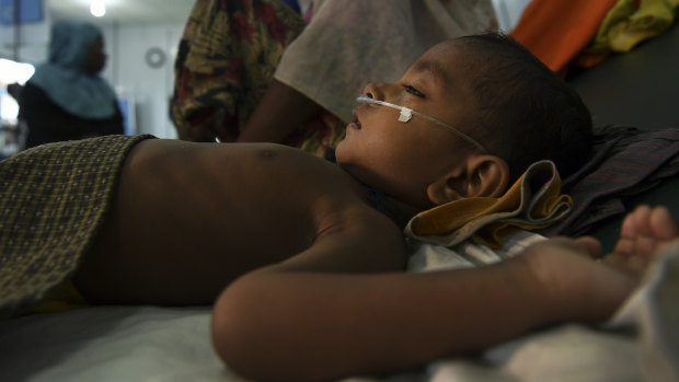 Jomil aged 2 lays unconscious whilst being treated for fever and breathing problems at the Medecins Sans Frontieres hospital in Kutupalong Camp. MSF are treating many people with respiratory tract infections and diarrhoea due to the living conditions in the camps.