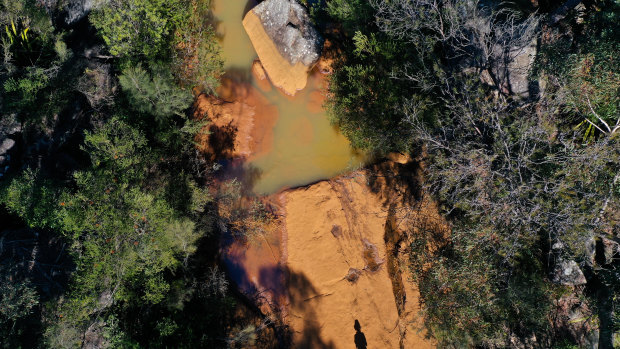 Discolouration at the spot in the Eastern Tributary where the water vanishes, in the Woronora catchment area, south-west of Sydney.