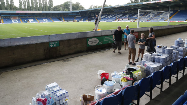 Last legs: Volunteers help clean up Gigg Lane stadium, home of Bury Football Club, as they awaited the fate of the club.