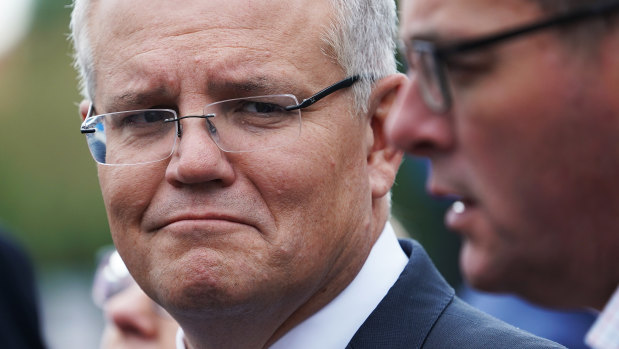 Scott Morrison and Daniel Andrews at Sunshine railway station on Wednesday.