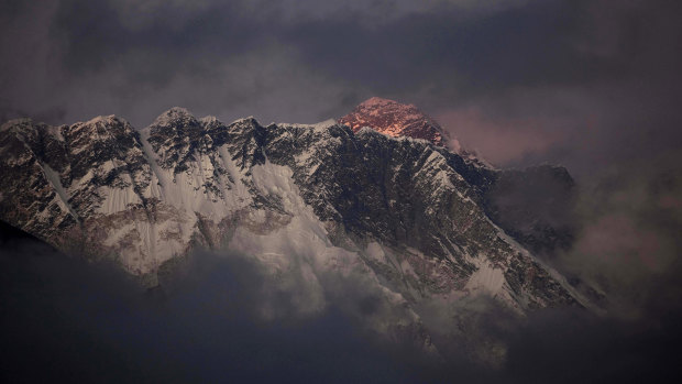 The sun sets on Mount Everest, seen from Tengboche in the Khumbu region of Nepal.