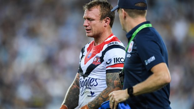 Pain: Roosters co-captain Jake Friend leaves the field during the win over Parramatta at ANZ Stadium.