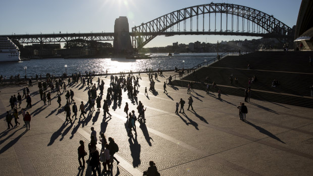 People enjoy the surprisingly warm winter weather in Sydney’s Circular Quay.