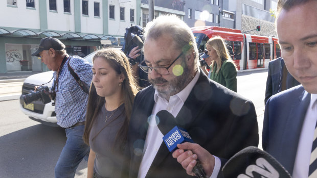 Brett Button (right) with his lawyer fronting Newcastle court in April. He pleaded guilty to 10 counts of dangerous driving on Wednesday.