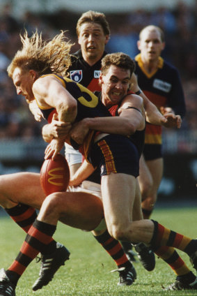 Paul Salmon tackles Wayne Weidemann.