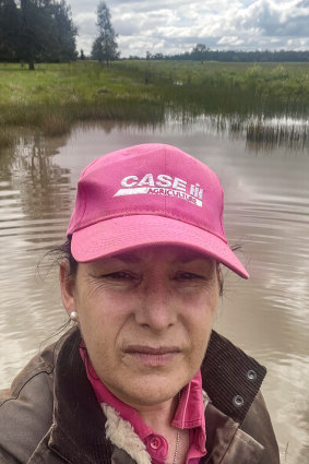Lisa Minogue inspects flooding on her property at Barmedman, in western NSW.