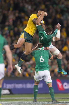 Aerial dogfight: Israel Folau and Peter O'Mahony contest the football in the air.